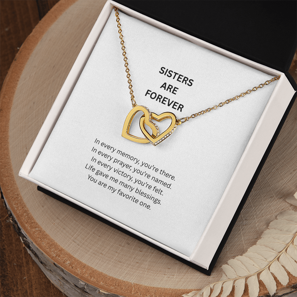 Detailed view of sister heart pendant with sparkling crystals